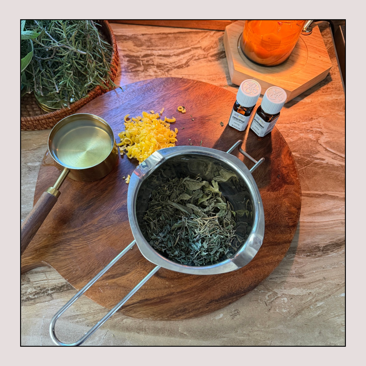 homemade decongestant chest rub ingredients: oil, beeswax, essential oils and dried herbs.